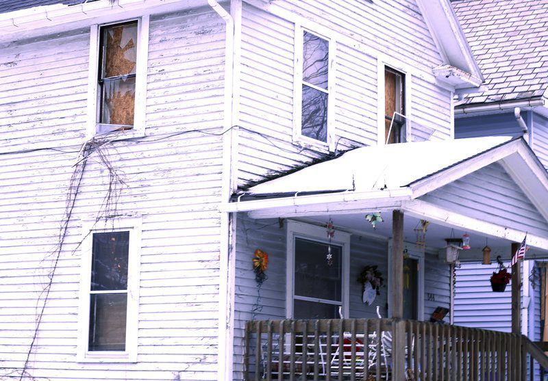 Firefighters rescue reluctant woman from burning home